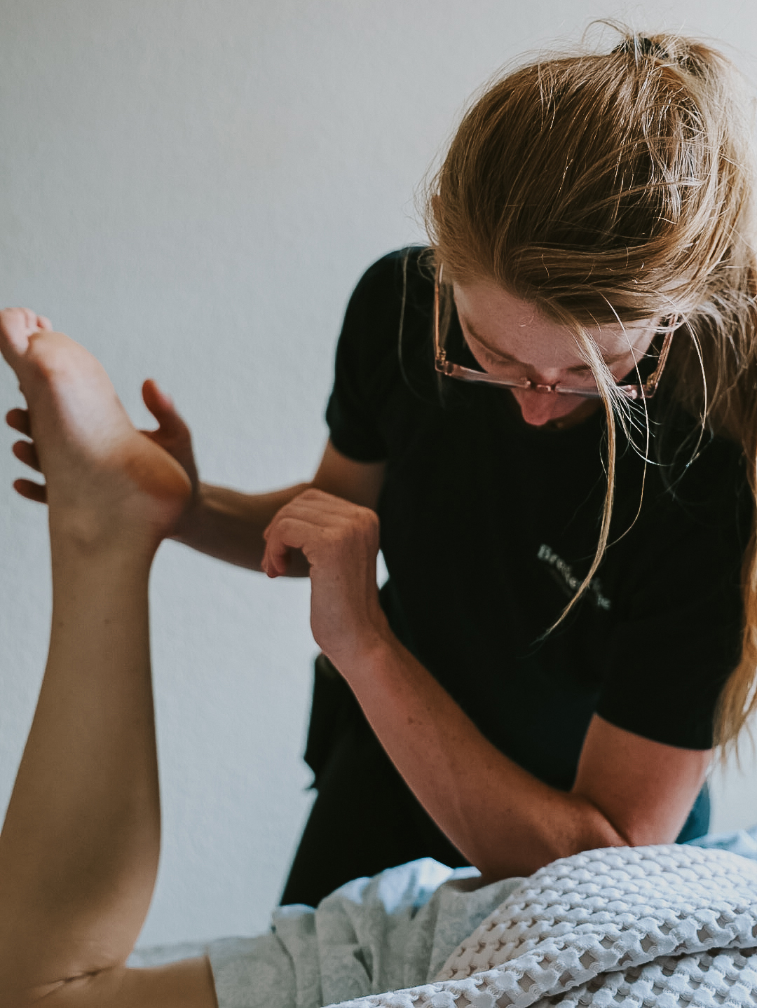 Breckenridge Mountain Massage owner, Katie Gilbert, giving someone a massage