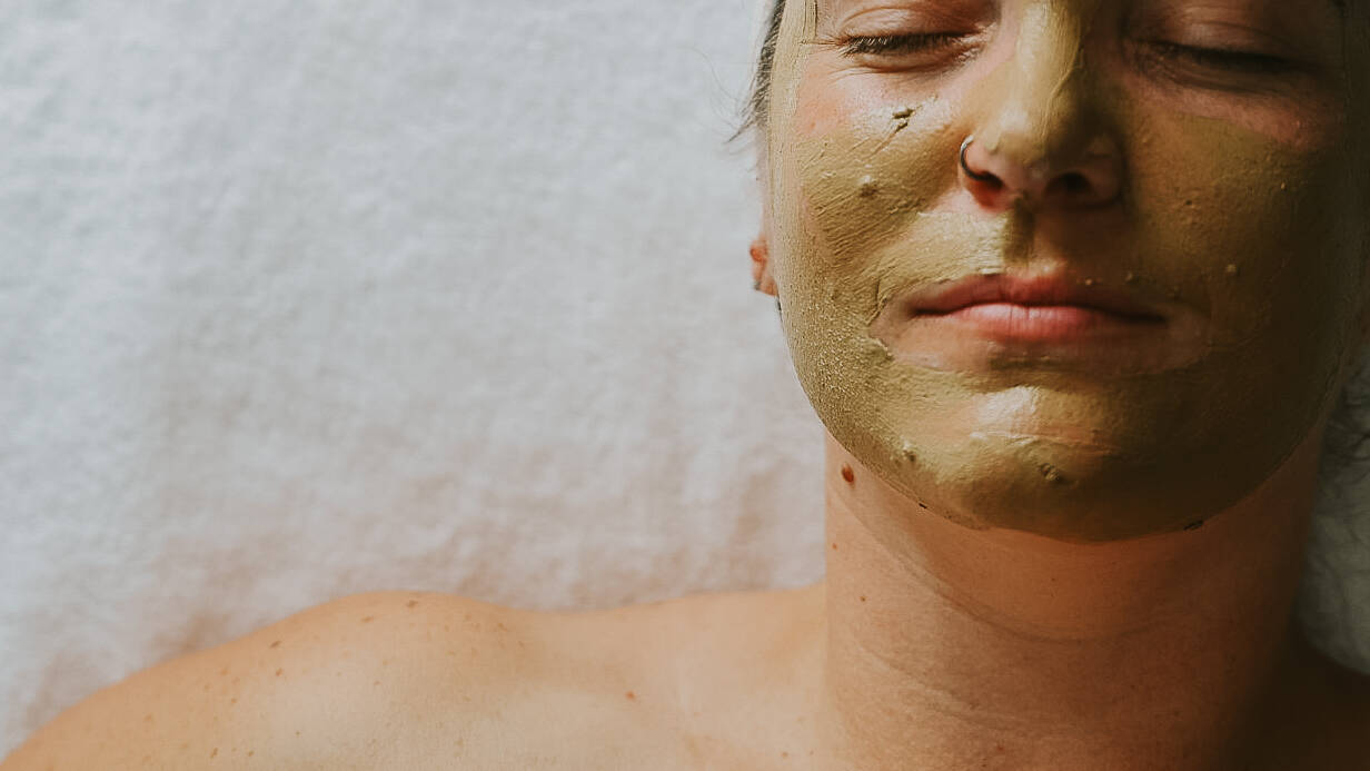Women laying with a hydrating and brightening face mask