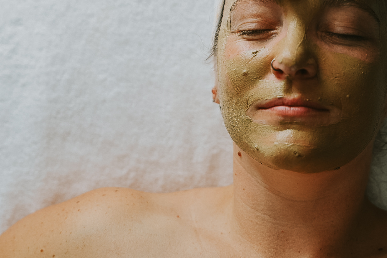 Women laying with a hydrating and brightening face mask